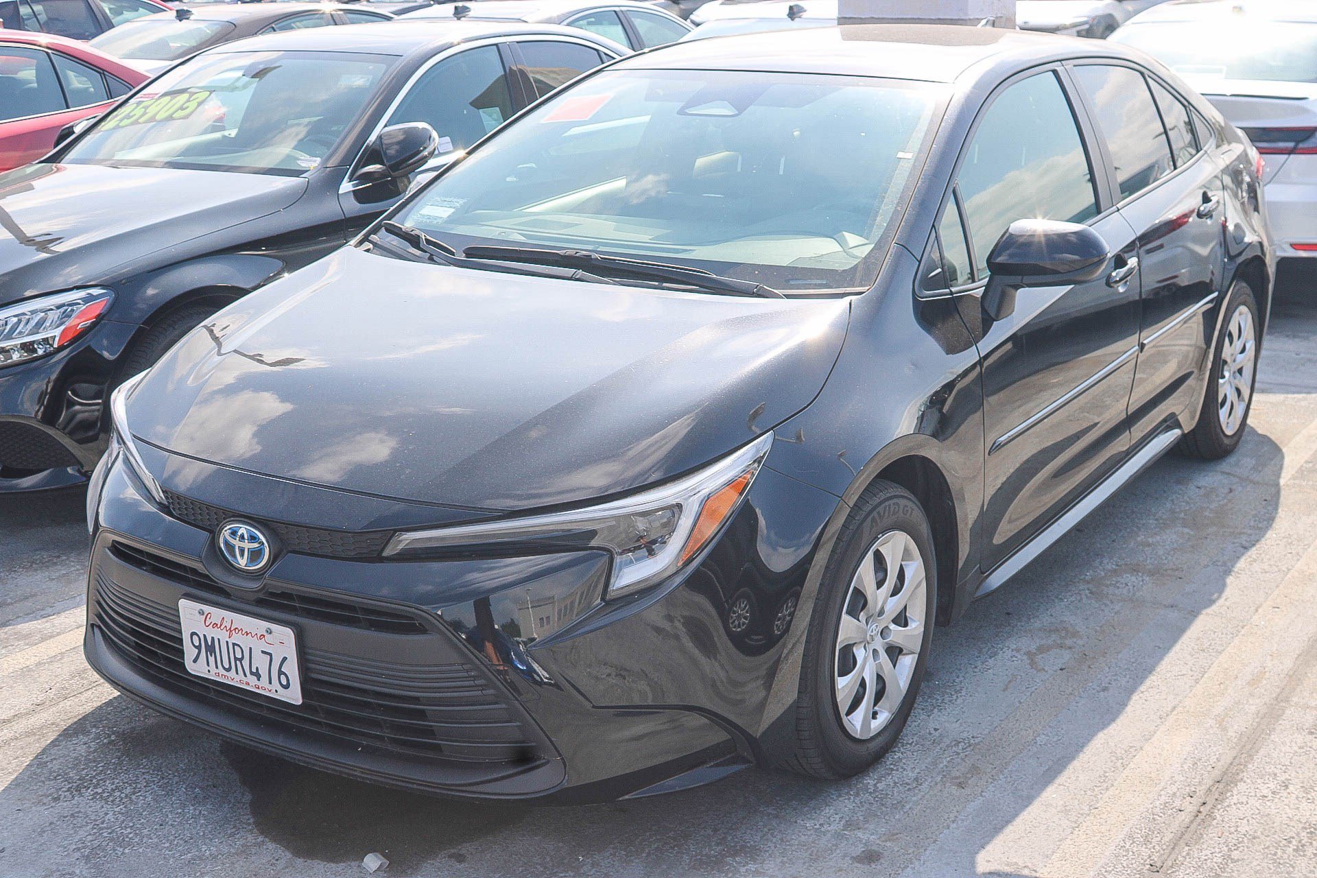 Used 2024 Midnight Black Metallic Toyota Hybrid LE image 4