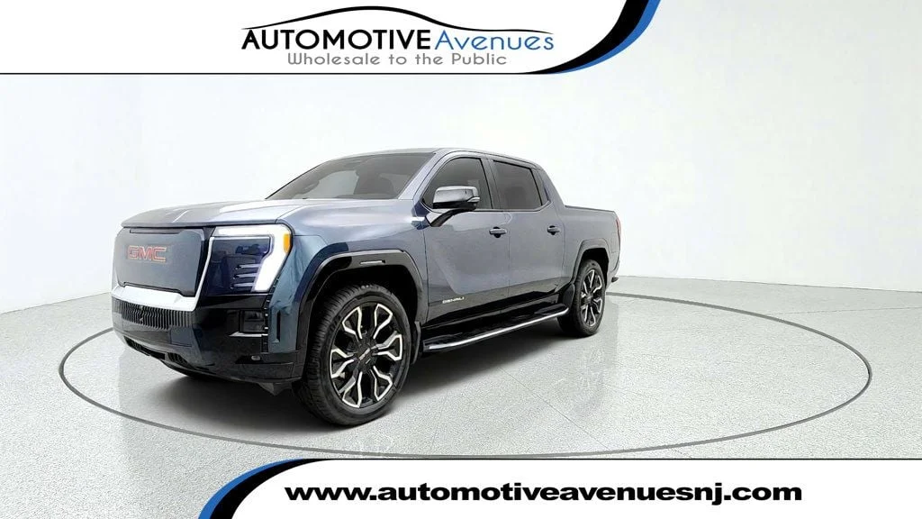Used 2026 Deep Ocean Metallic GMC e4WD Crew Cab Max Range Denali image 1