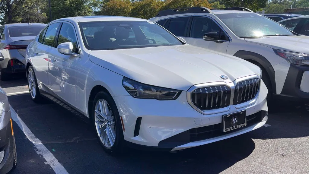 Used 2025 Mineral White Metallic BMW 530i xDrive image 1