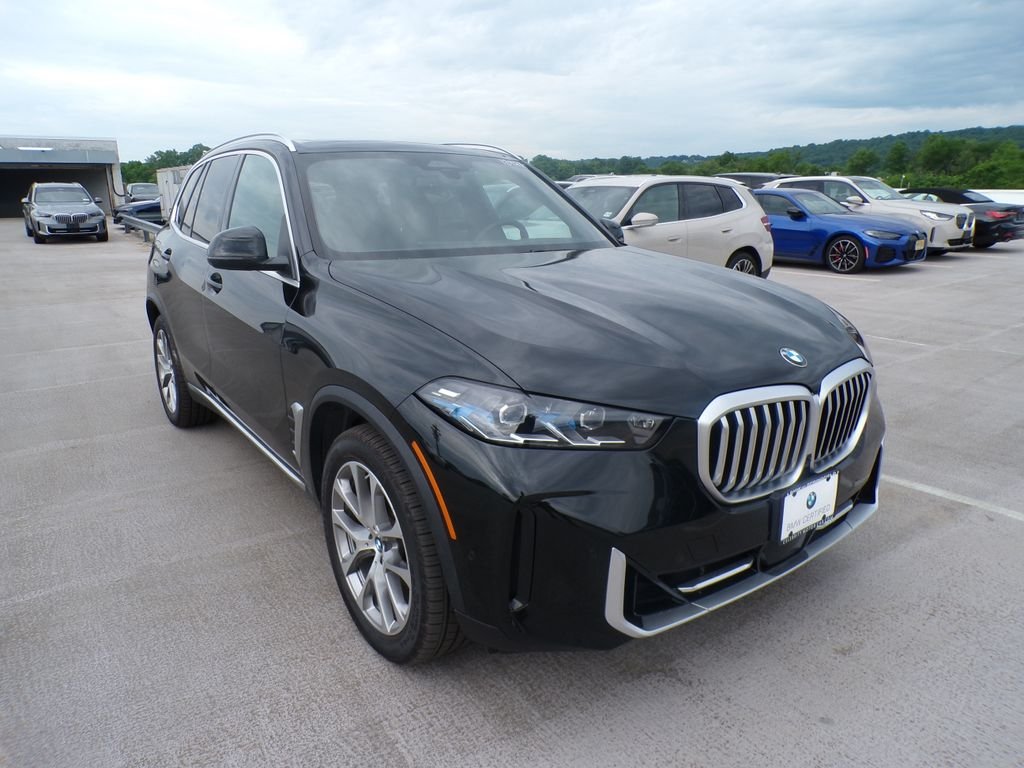 Certified Used 2024 Black Sapphire Metallic BMW xDrive40i image 1