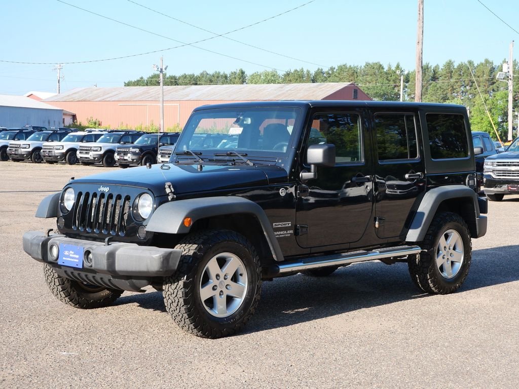 Used 2013 Black Jeep Unlimited Sport image 2