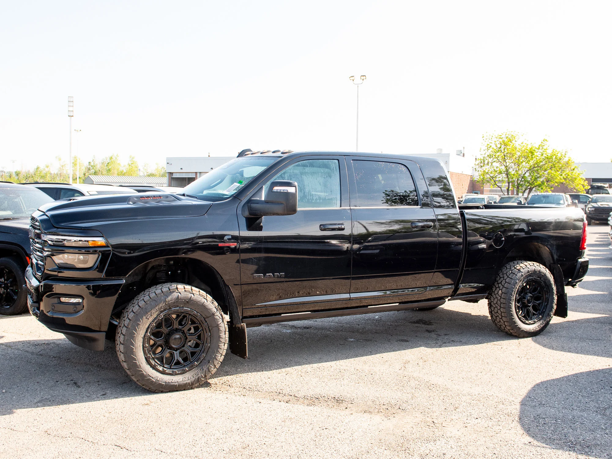 New 2026 Black RAM Laramie* Mega Cab, 2 Inch Lift, 35 Inch Tires, Trigger Industries Mudflaps image 4