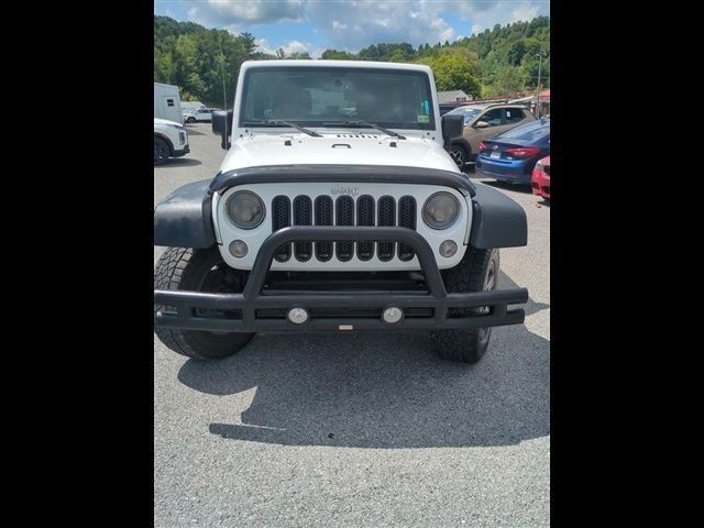 Used 2016 White Jeep Unlimited Sport image 1