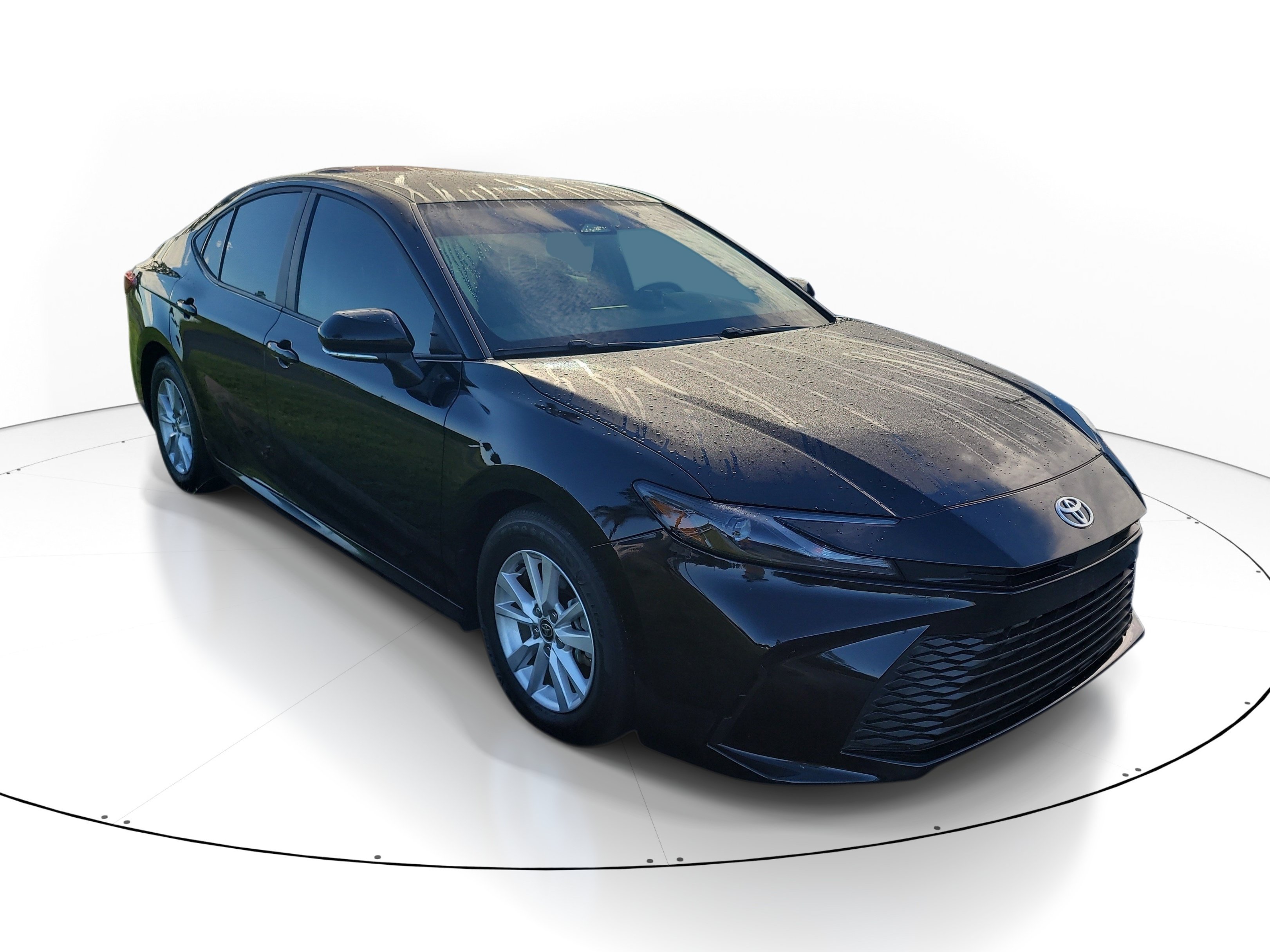 Used 2025 Midnight Black Metallic Toyota LE image 1