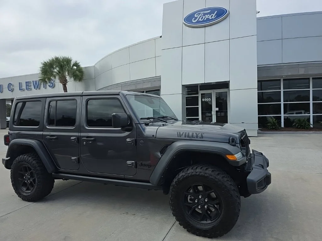 Used 2024 Crystal Metallic Jeep Sport image 1