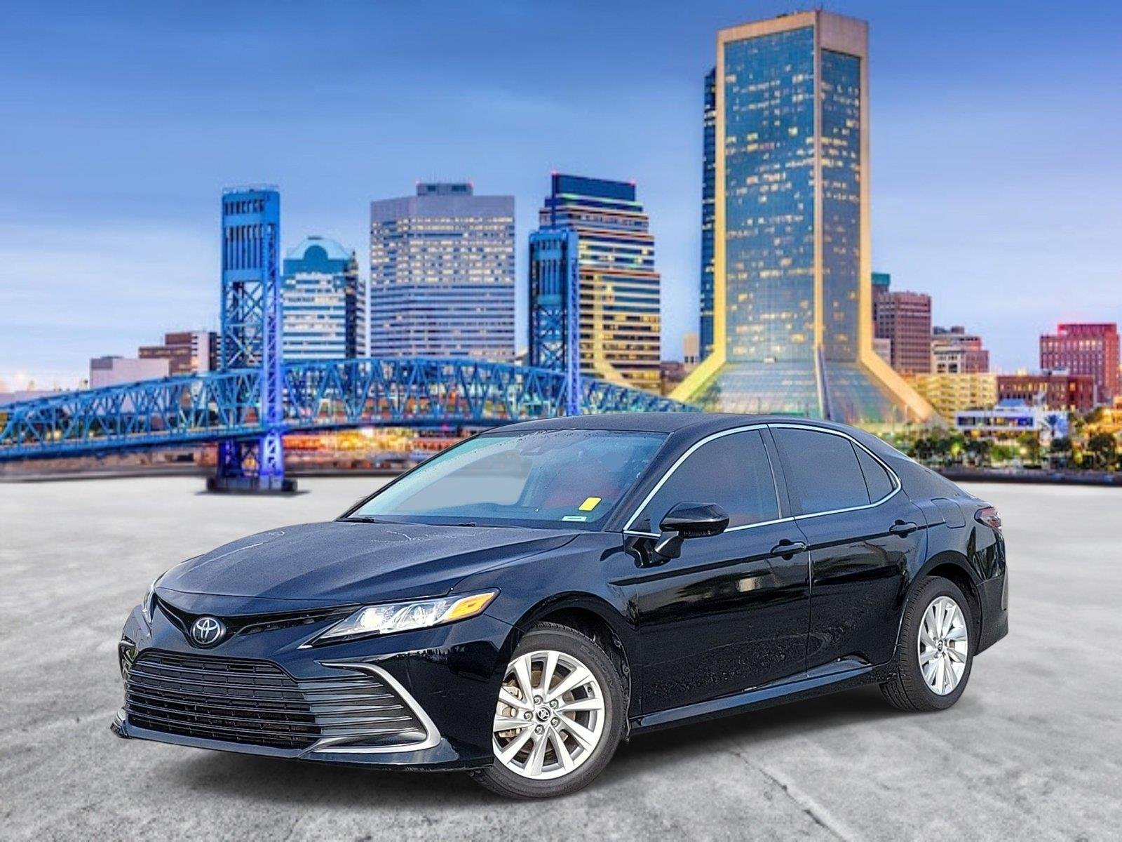 Used 2023 Midnight Black Metallic Toyota LE image 1