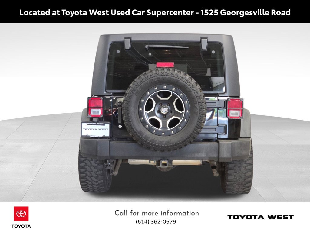 Used 2013 Black Jeep Unlimited Sport image 8