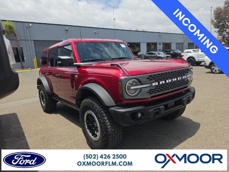 Used 2025 RUBY RED MET TNTD CLEARCOAT Ford Badlands image 1