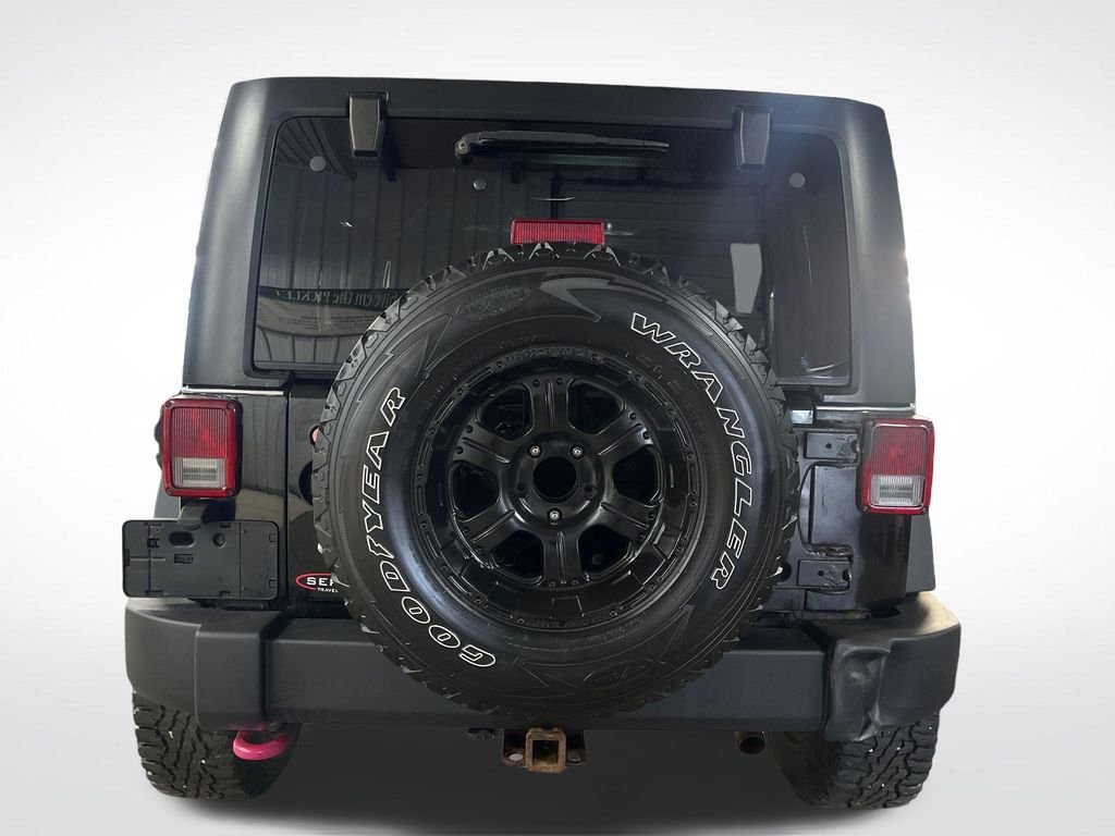 Used 2013 Black Jeep Unlimited Sport image 4