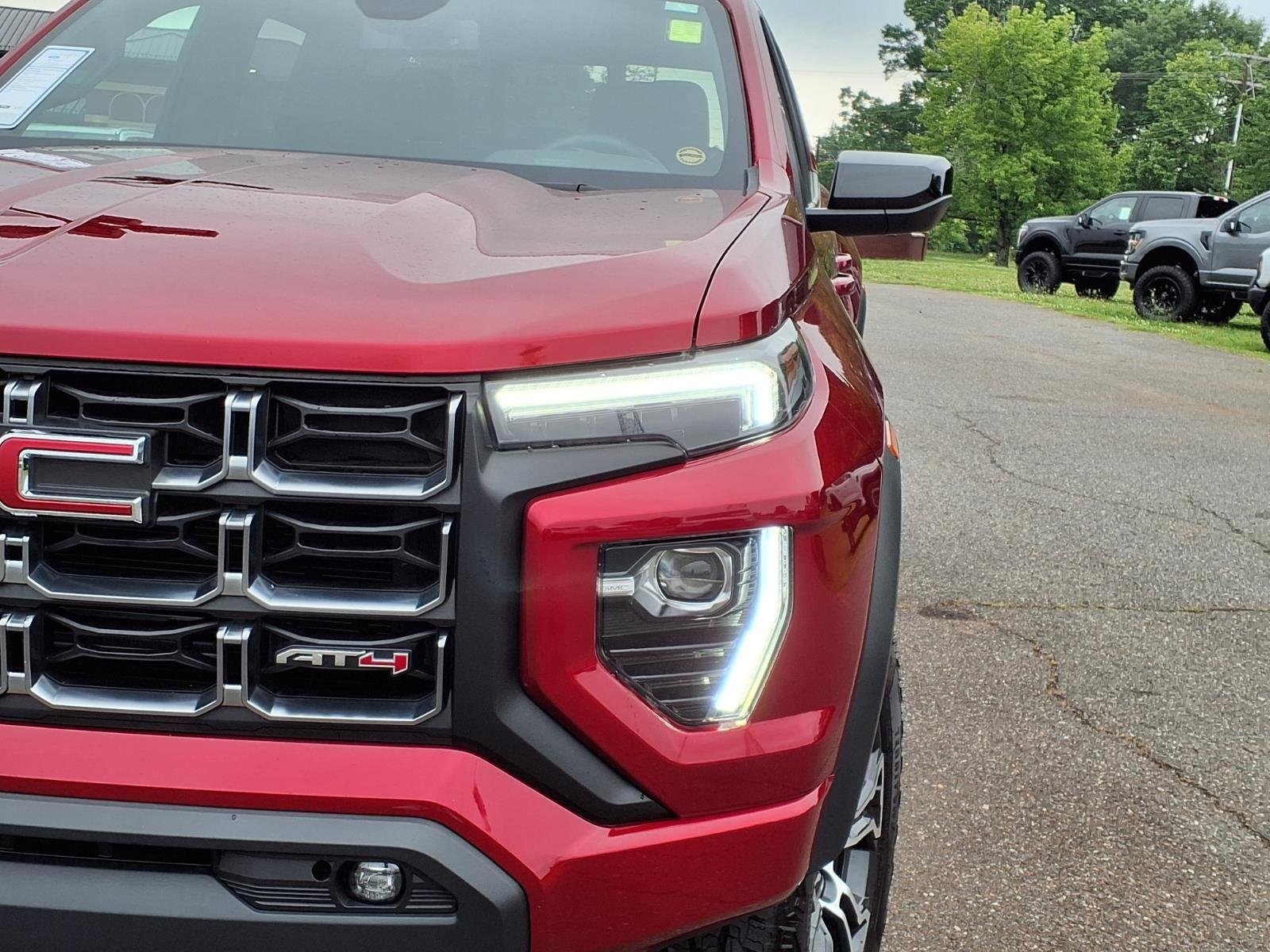 Used 2025 Volcanic Red Tintcoat GMC 4WD AT4 image 16