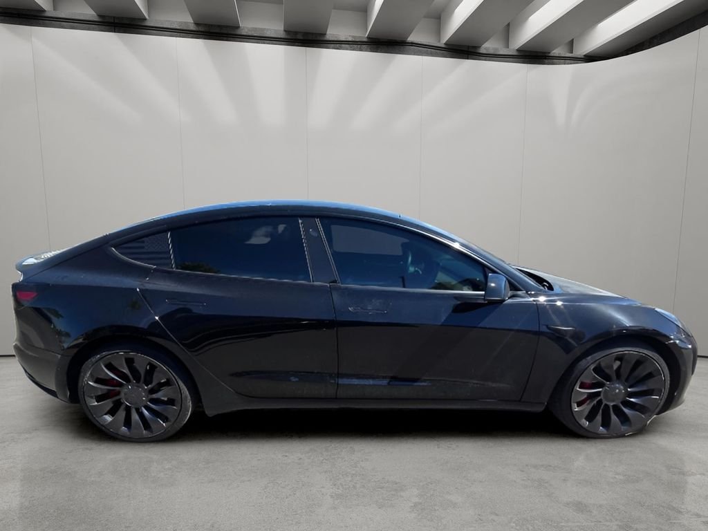 Used 2022 Solid Black Tesla Performance image 11