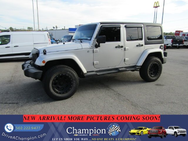 Used 2012 Silver Jeep Unlimited Sahara image 1