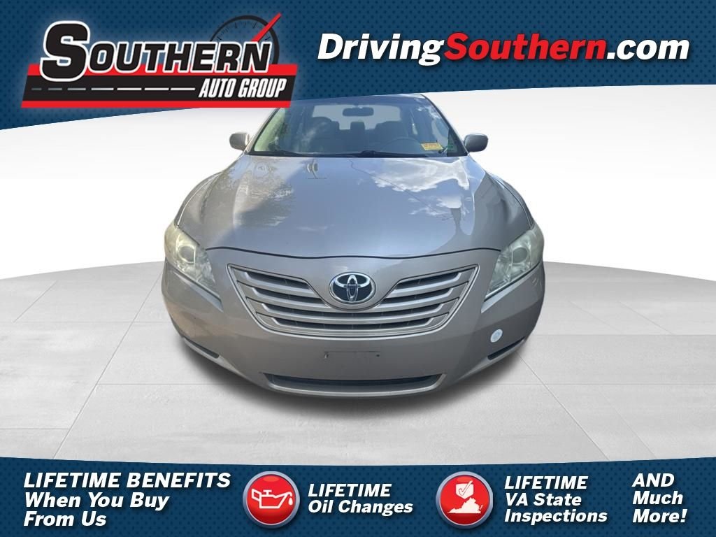 Used 2009 Gold Toyota LE image 1