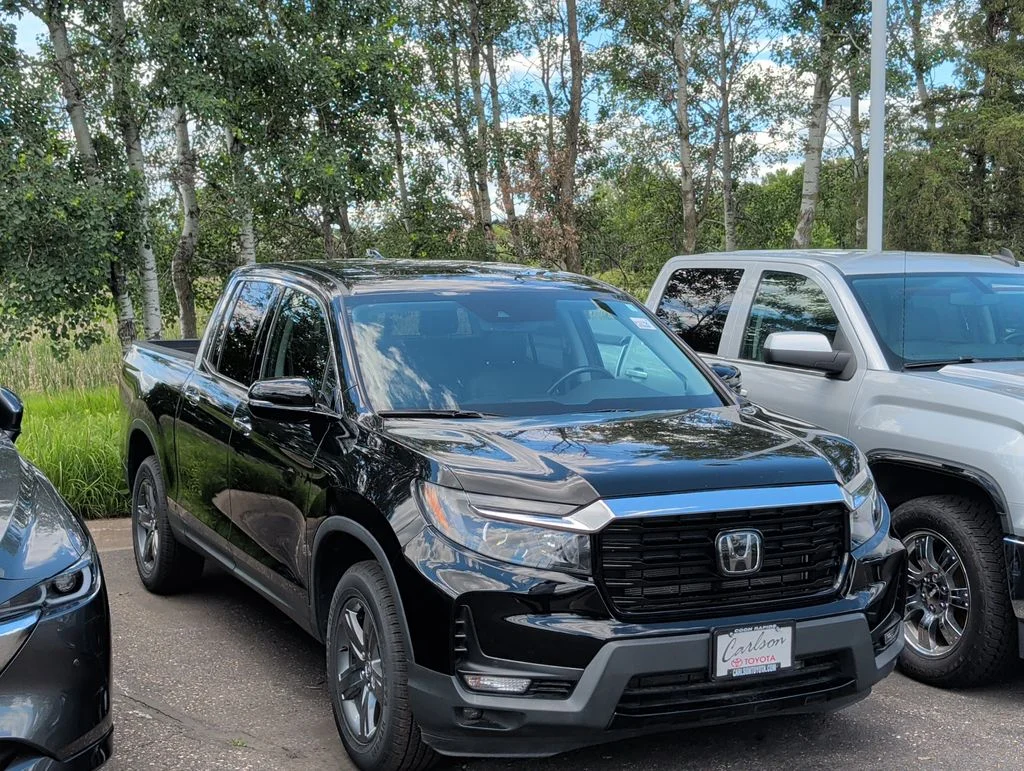 Used 2023 Honda Ridgeline RTL-E with VIN 5FPYK3F75PB011419 for sale in Minneapolis, Minnesota
