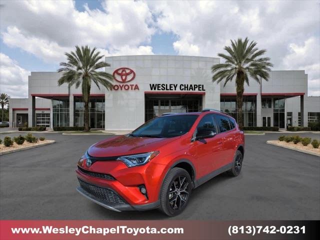 Certified Used 2016 Hot Lava Toyota SE image 1
