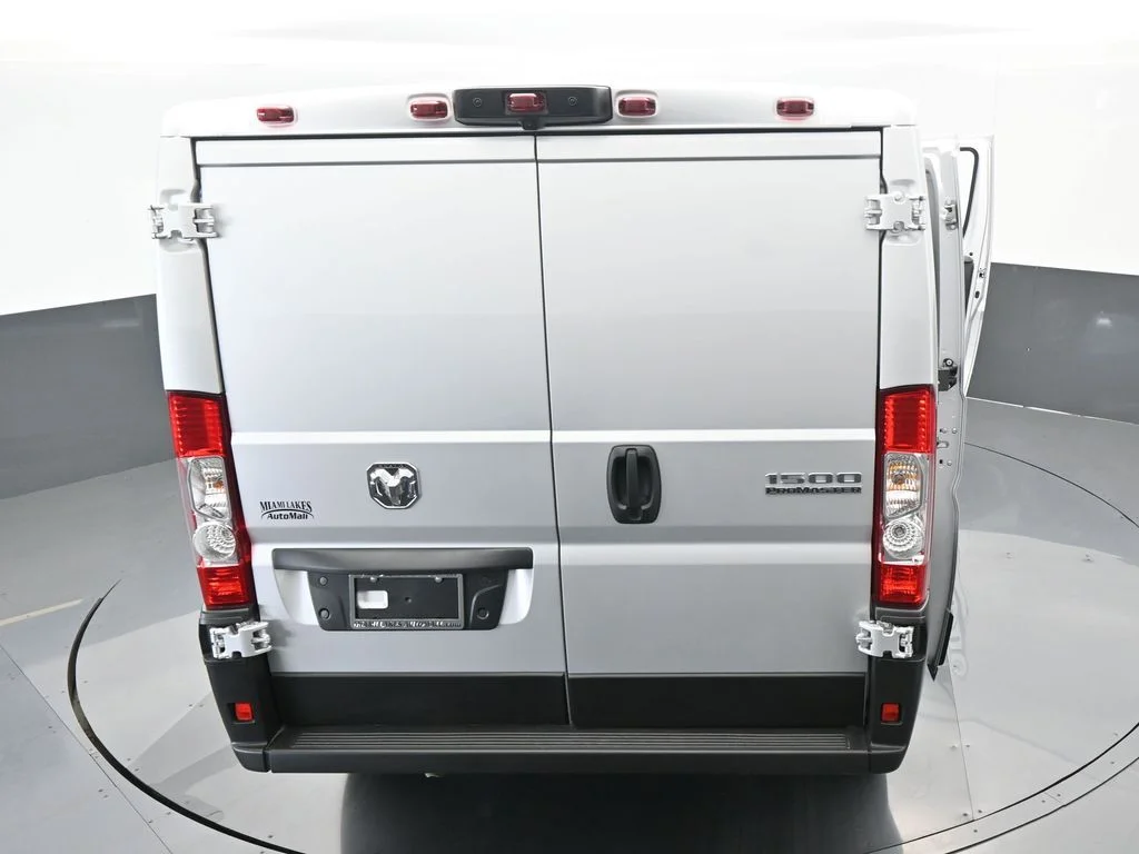 Used 2025 Bright Silver Clearcoat Metallic Ram Low Roof image 59
