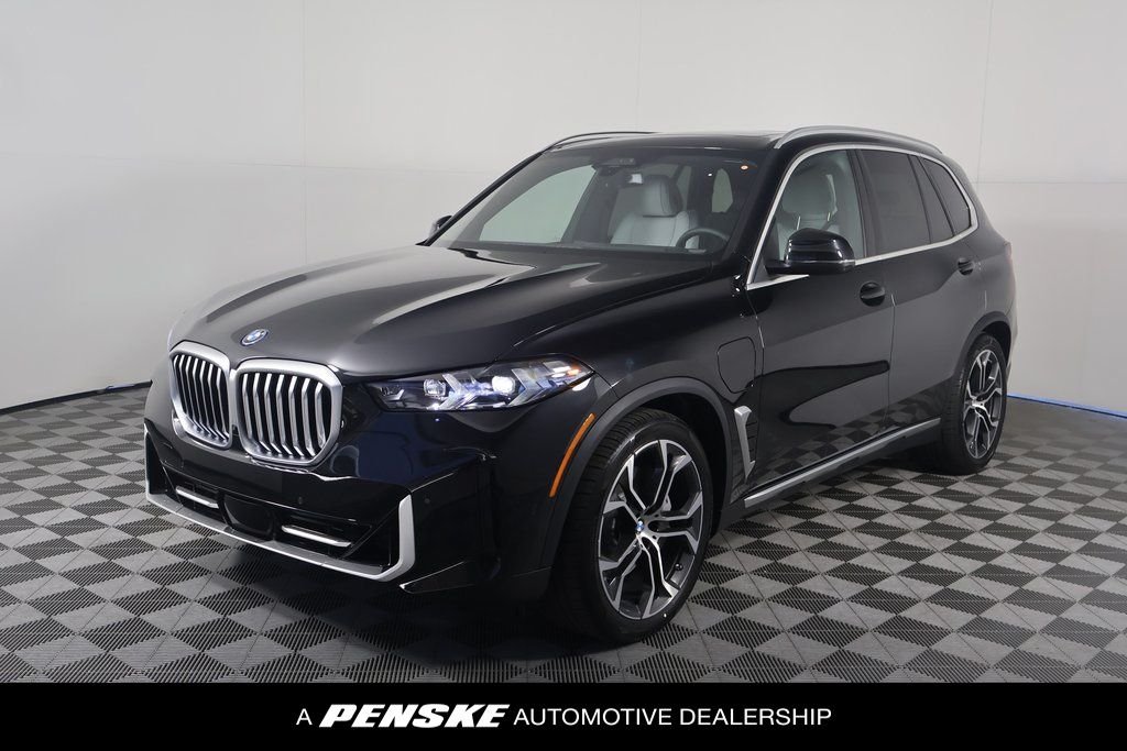 Used 2026 Black Sapphire Metallic BMW xDrive50e image 1