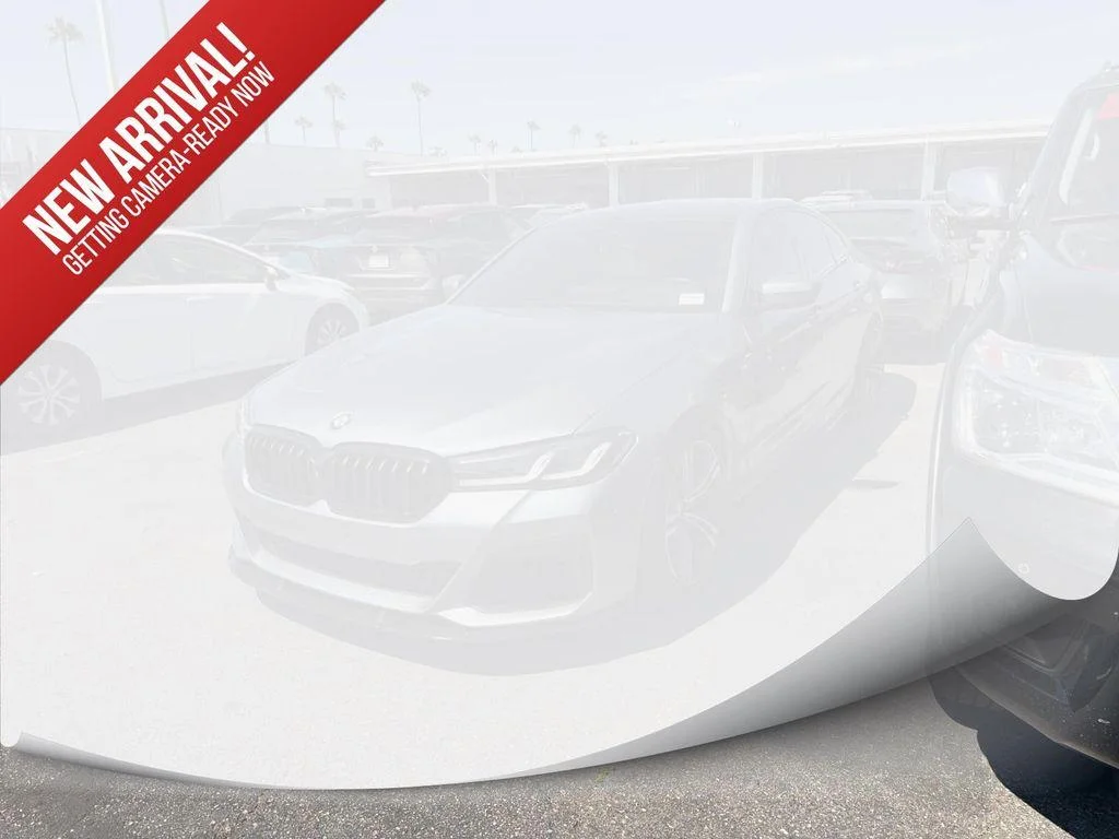 Used 2021 Bluestone Metallic BMW M550i xDrive image 1