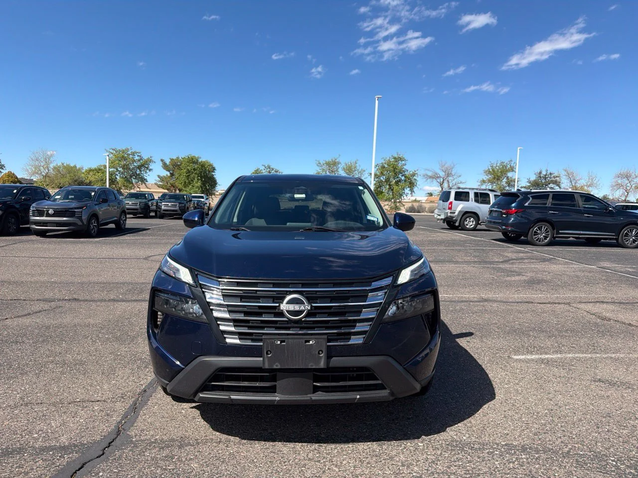 Used 2024 Deep Ocean Blue Pearl Nissan SV image 1