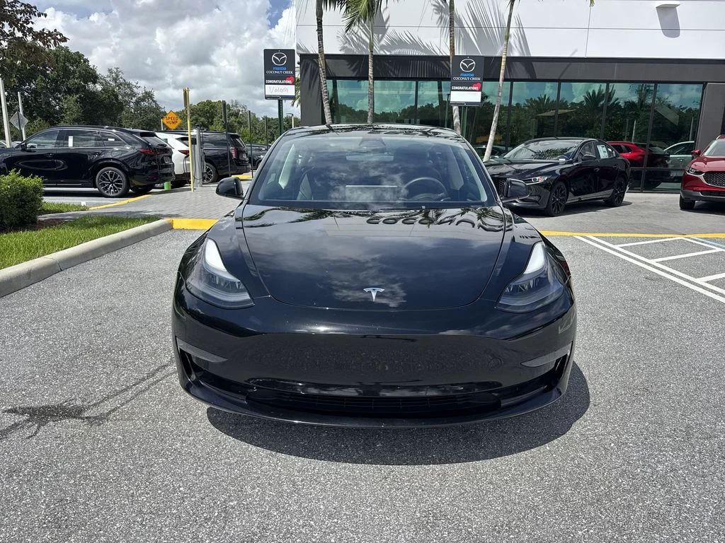 Used 2023 Solid Black Tesla  image 8