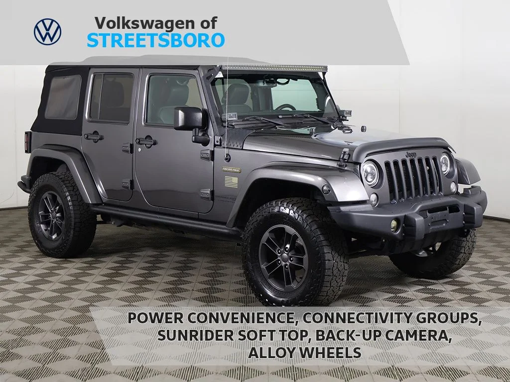 Used 2018 Granite Crystal Metallic Clearcoat Jeep Unlimited Sport image 1