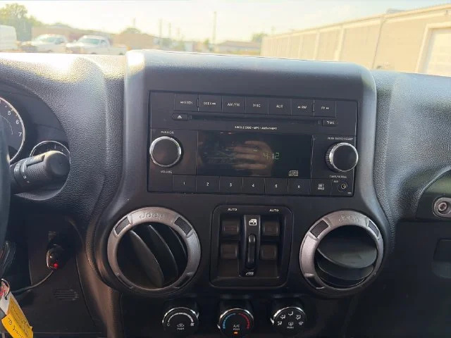 Used 2015 Orange Jeep Unlimited Sport image 11