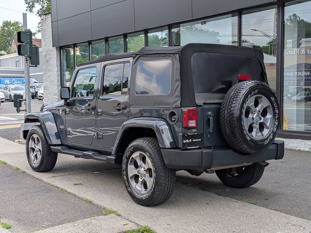 Used 2016 Black Jeep Unlimited Sahara image 9