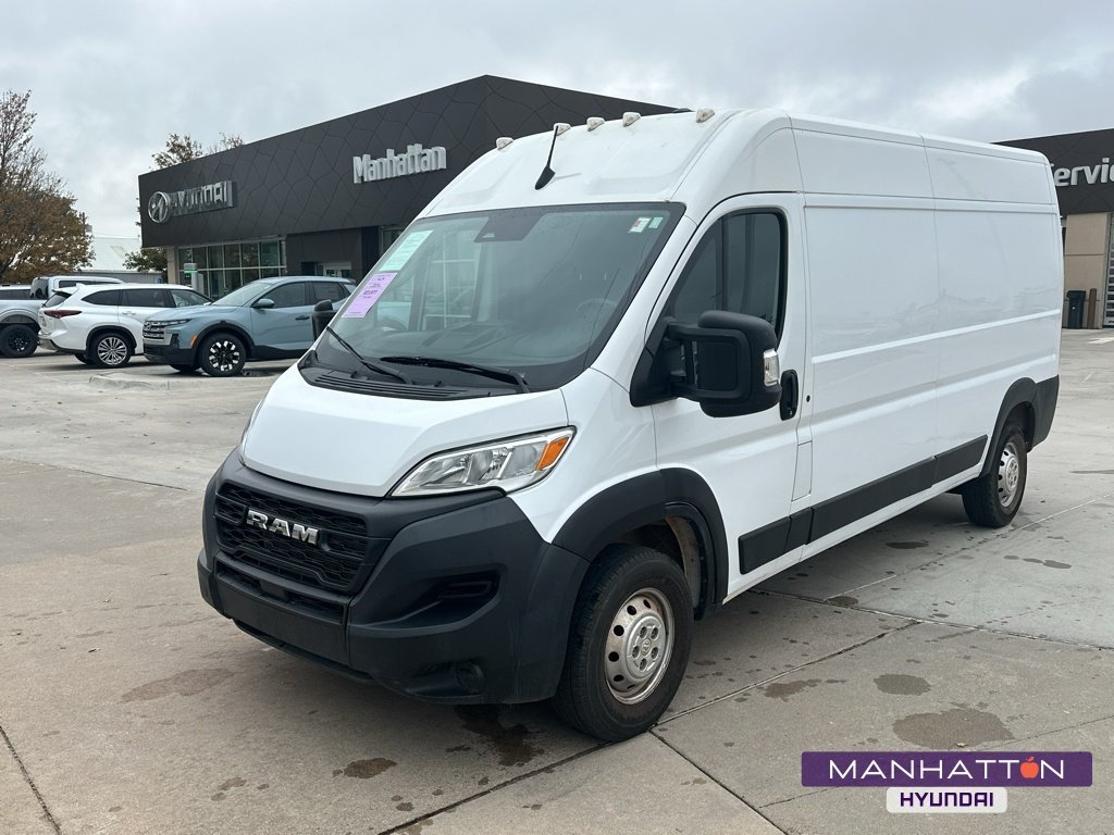 Used 2023 Bright White Clearcoat Ram High Roof 159WB image 1