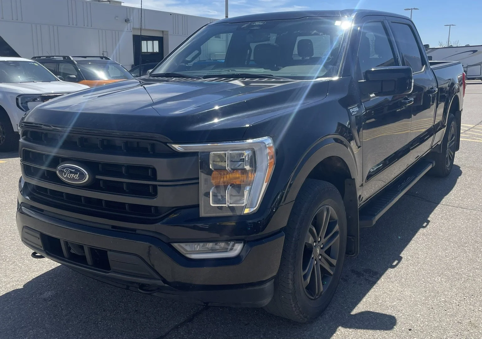 Used 2022 Black Ford LARIAT SuperCrew image 1