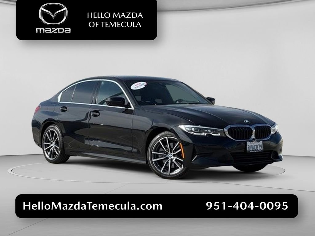 Used 2021 Black Sapphire Metallic BMW 330e iPerformance image 1