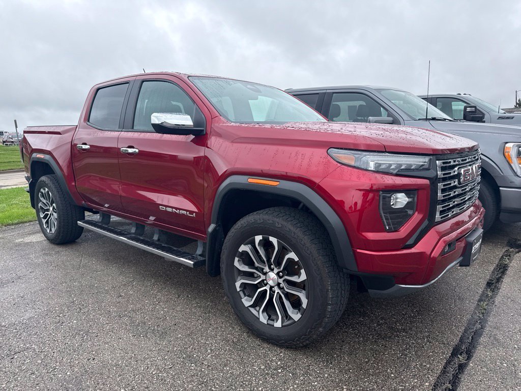 Used 2023 VOLCANIC RED TINTCOAT GMC 4WD Denali image 1