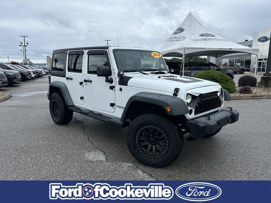 Used 2012 Bright White Jeep Unlimited Sport image 2