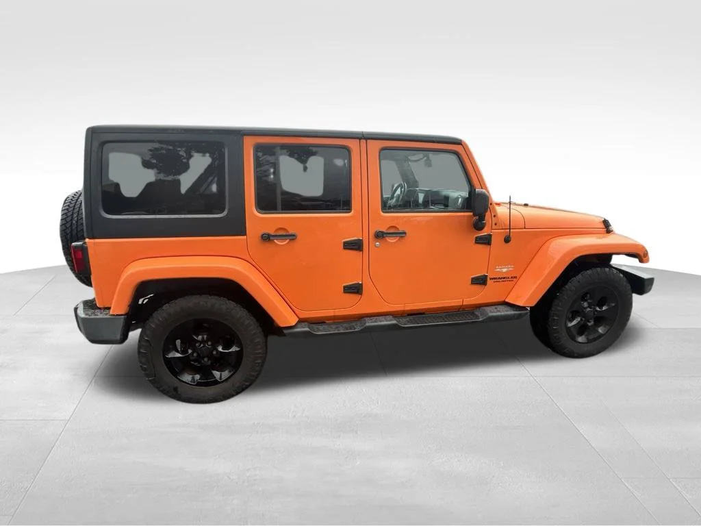 Used 2013 Orange Jeep Unlimited Sahara image 15
