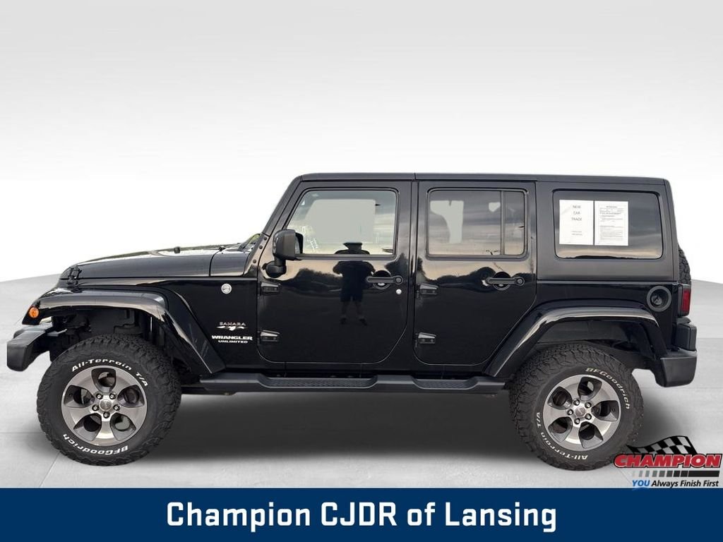 Used 2016 Black Jeep Unlimited Sahara image 4