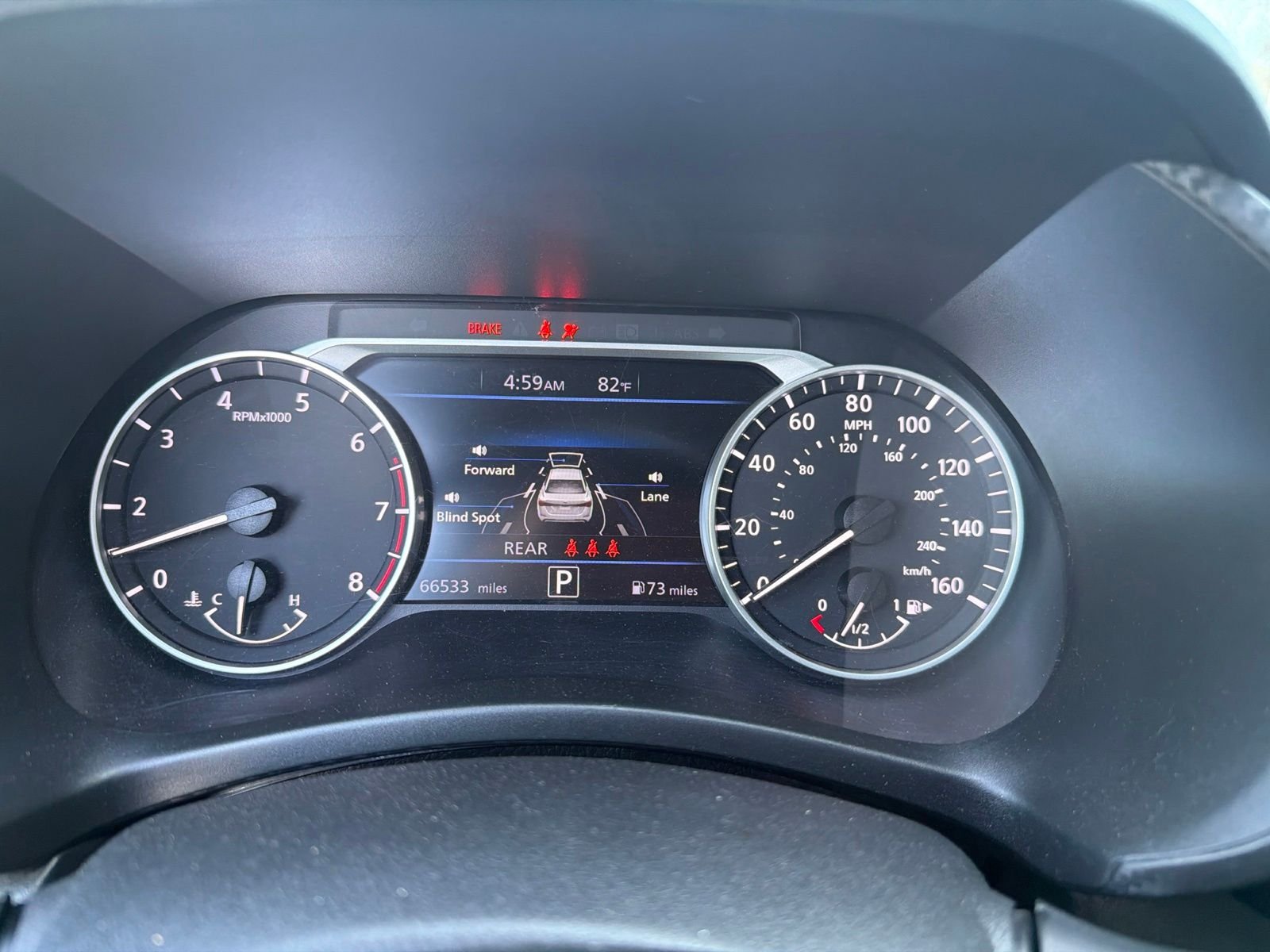 Used 2024 Electric Blue Metallic Nissan SV image 1