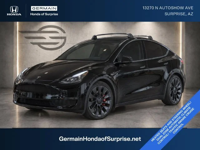 Used 2023 Solid Black Tesla Performance image 1