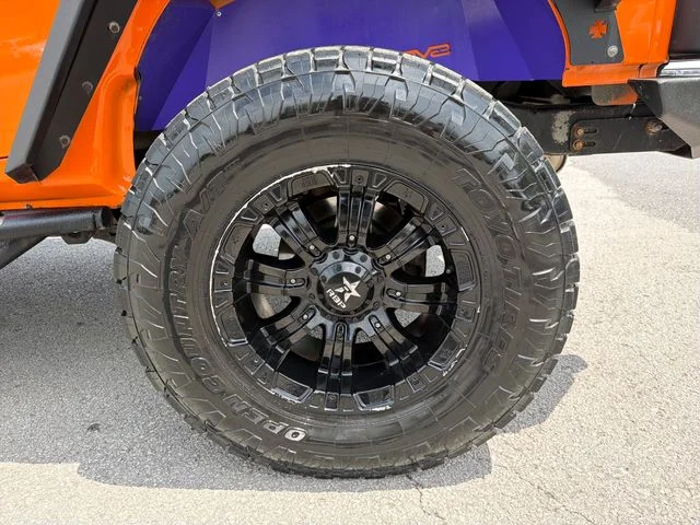 Used 2013 Orange Jeep Unlimited Rubicon image 25