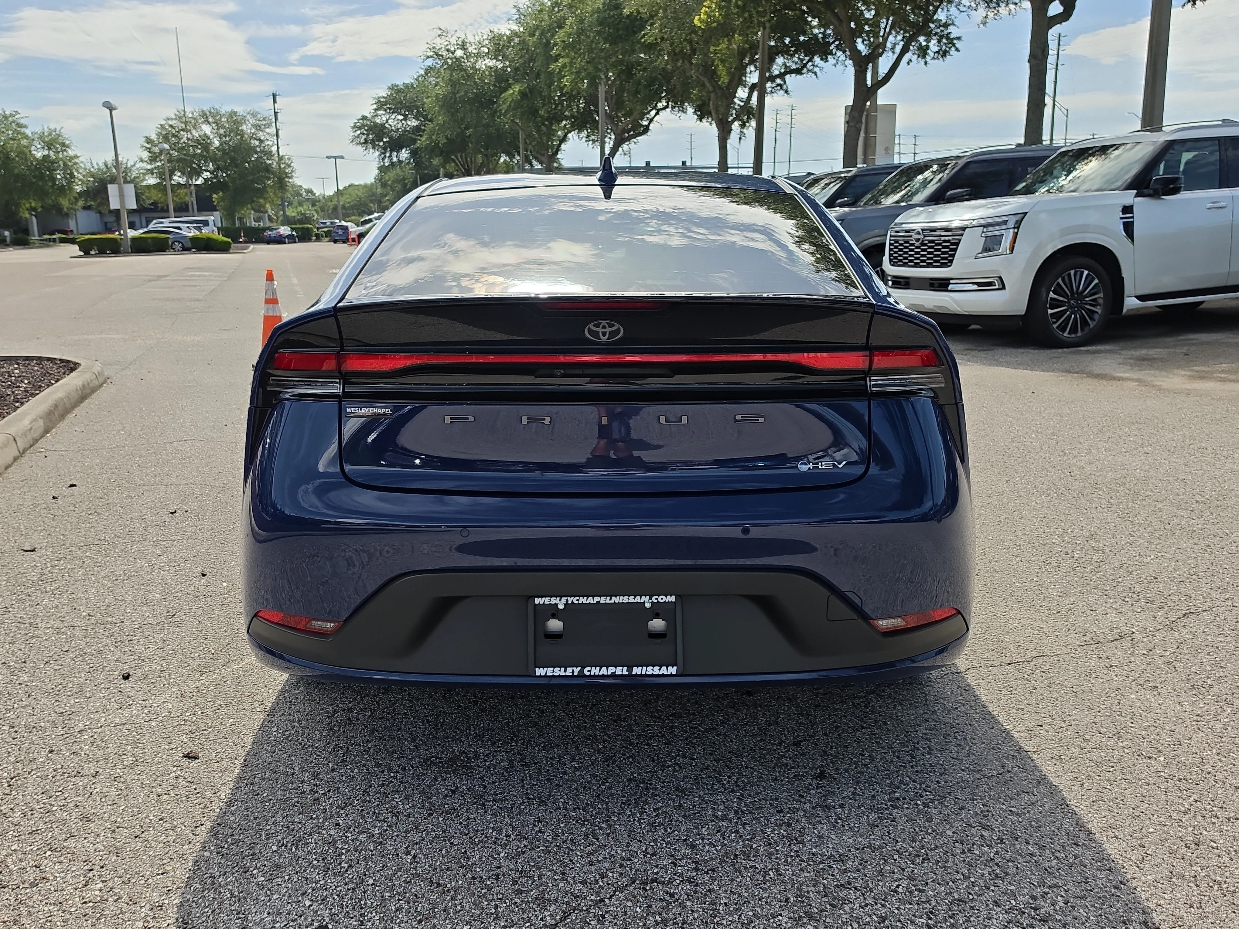 Used 2024 Reservoir Blue Toyota LE image 7