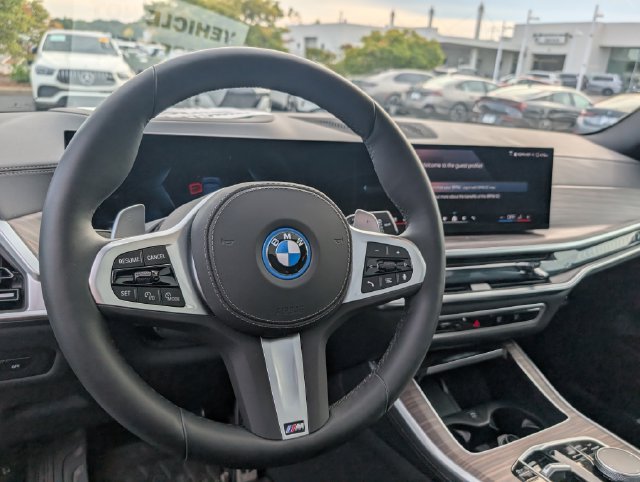 Certified Used 2026 Tanzanite Blue II Metallic BMW xDrive50e image 16