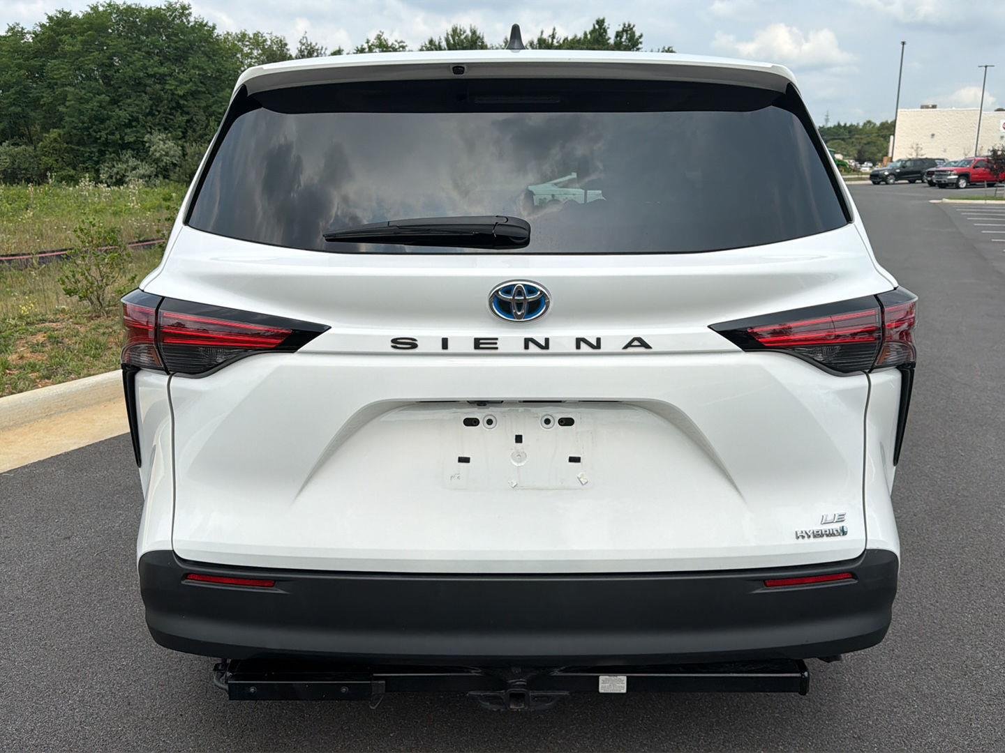 Used 2021 Super White Toyota LE image 2