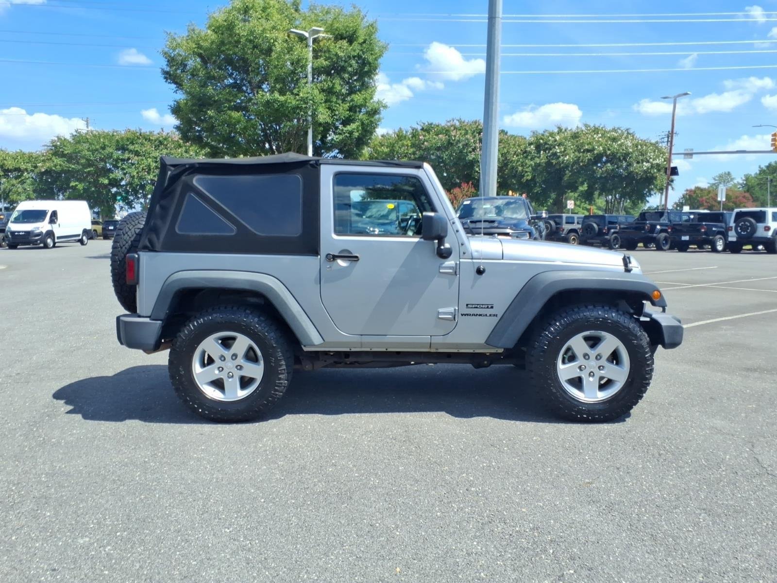 Used 2015 Billet Silver Metallic Clearcoat Jeep Sport image 9