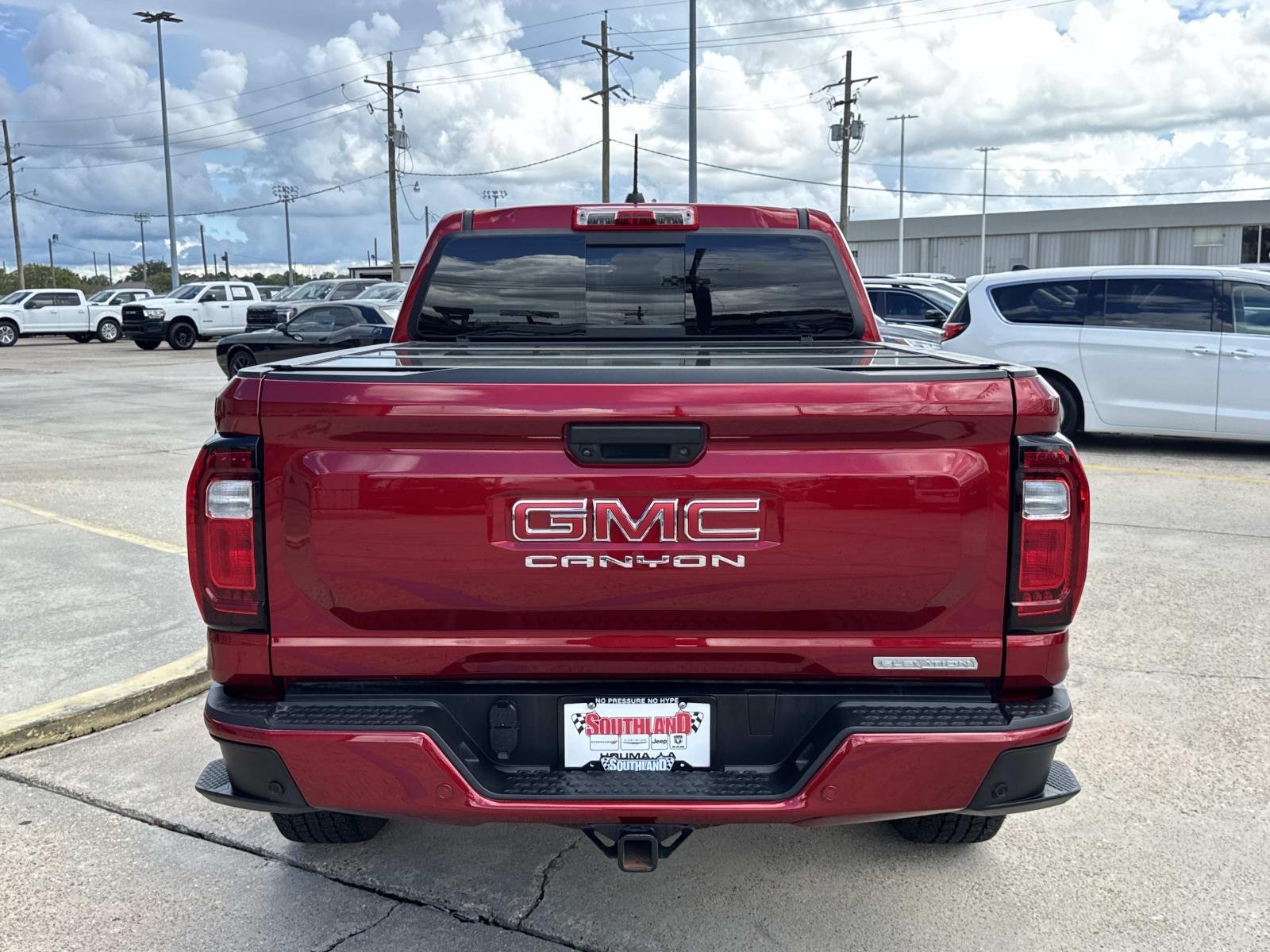 Used 2025 Volcanic Red Tintcoat GMC 2WD Elevation image 6