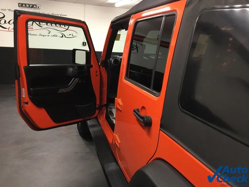 Used 2015 Orange Jeep Unlimited Sport image 24