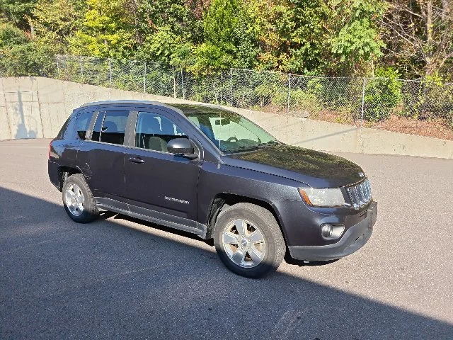 Used 2014 Maximum Steel Metallic Jeep Sport image 1