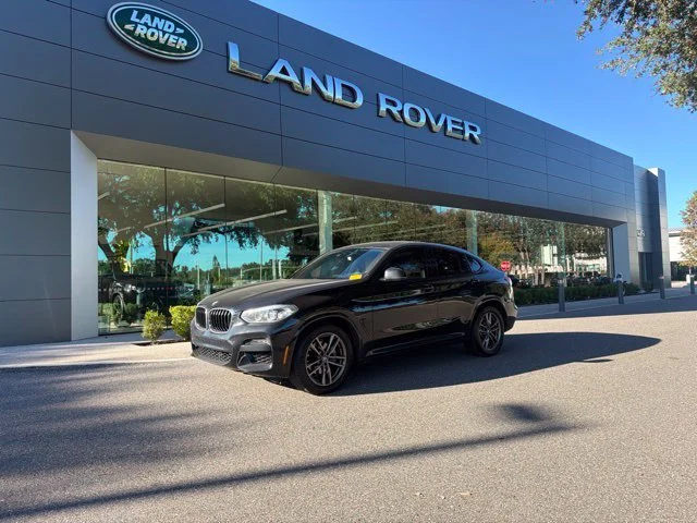 Used 2021 Black Sapphire Metallic BMW xDrive30i image 1