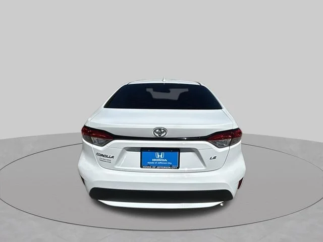 Used 2021 Super White Toyota LE image 4