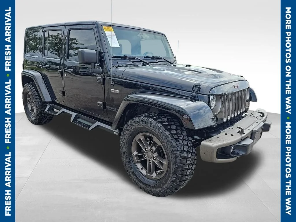 Used 2016 Black Jeep Unlimited Sahara image 1