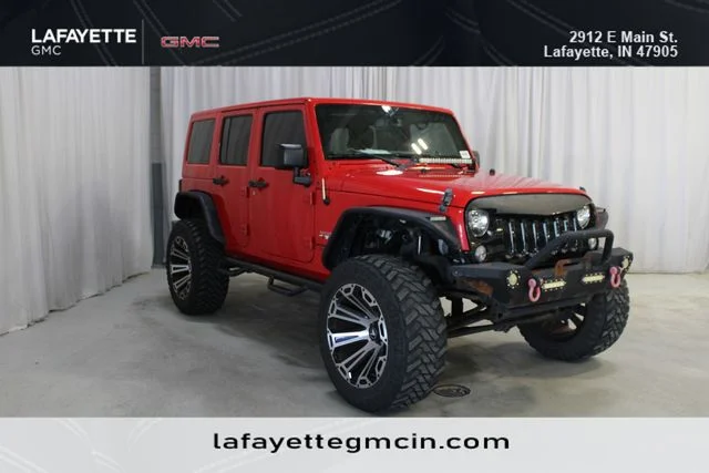 Used 2018 Red Jeep Unlimited Sahara image 1