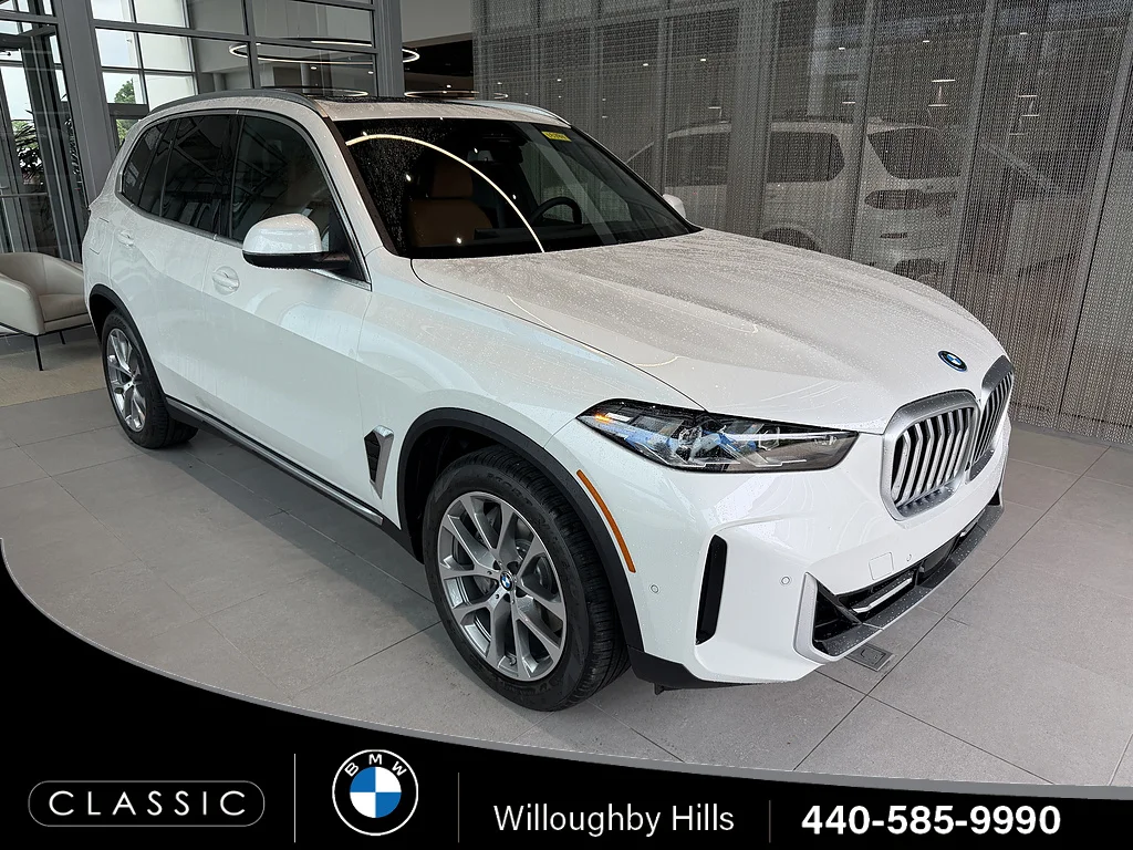 New 2026 Mineral White Metallic BMW xDrive50e image 1