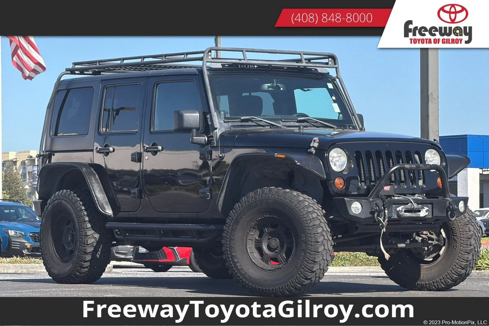 Used 2013 Black Jeep Unlimited Sport image 1